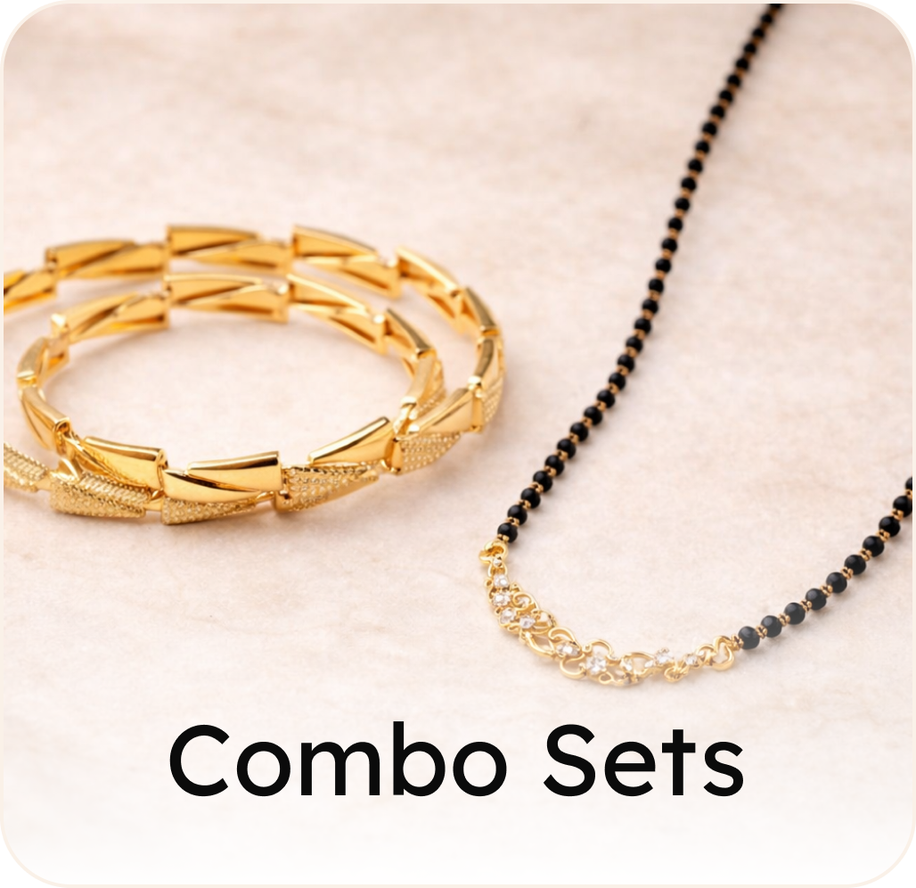 Gold bracelet and ring set on a white and brown background