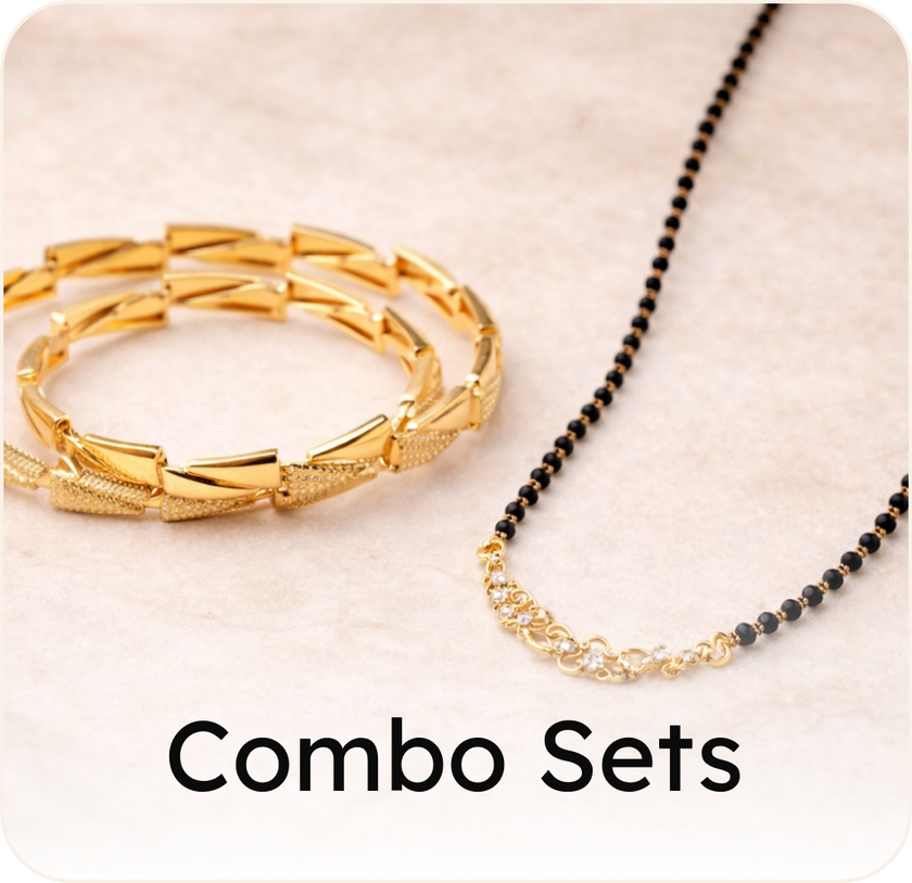 Gold bracelet and ring set on a white and brown background