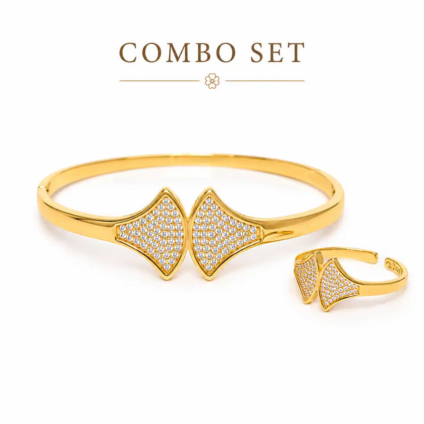 Gold bracelet and ring set on a white and brown background