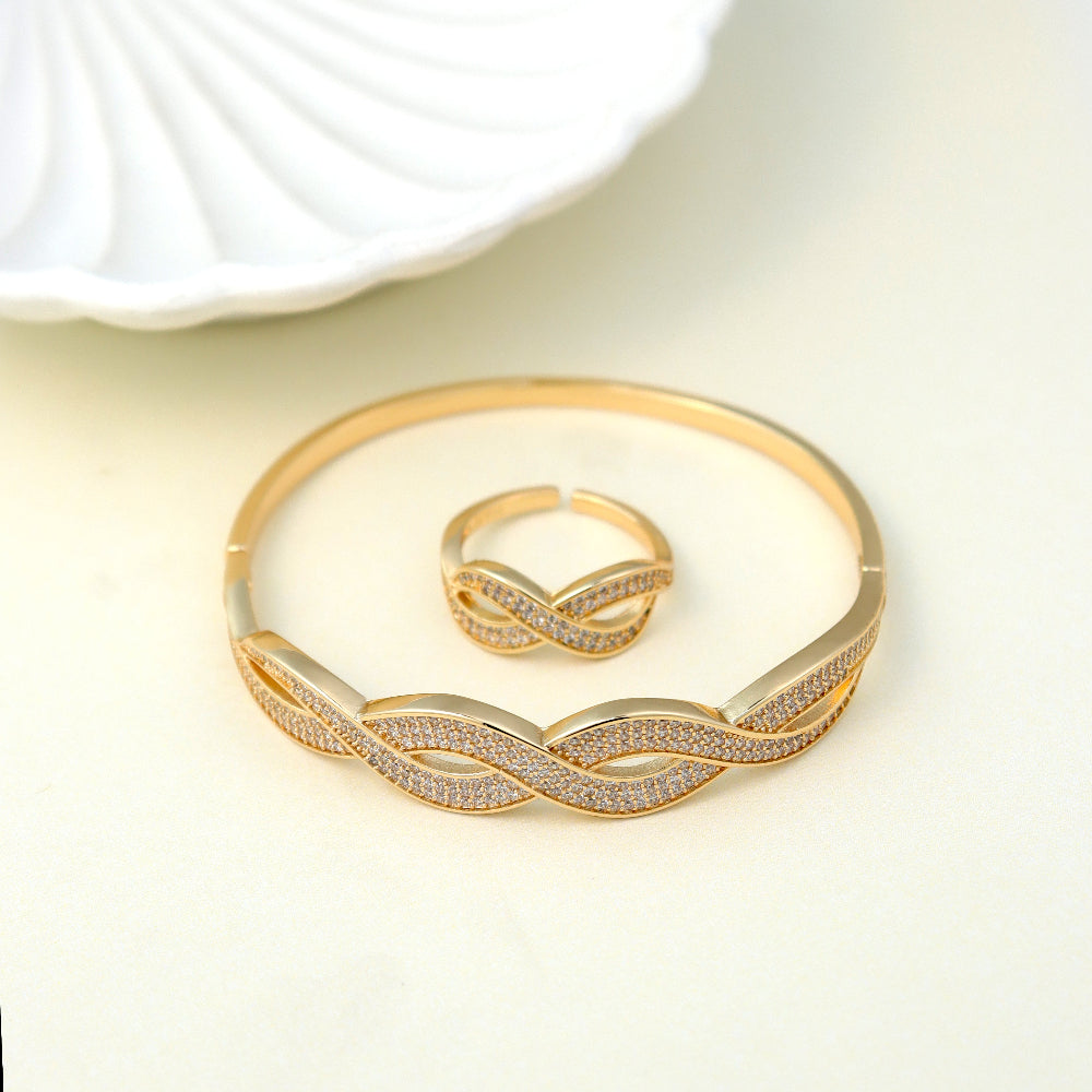 Elegant gold-plated bracelet and ring set with intertwined infinity design, encrusted with sparkling cubic zirconia stones – luxury jewelry by Own It Pure. Perfect for formal occasions, gifts, or everyday elegance. Shop high-quality gold accessories today.