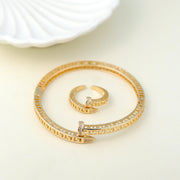 Luxury gold-plated open bangle bracelet and adjustable ring with Greek key design and sparkling cubic zirconia stones. Perfect for modern statement jewelry, minimalist accessories, and premium gift collections. open cuff bracelet, geometric jewelry, statement ring, premium fashion accessories.