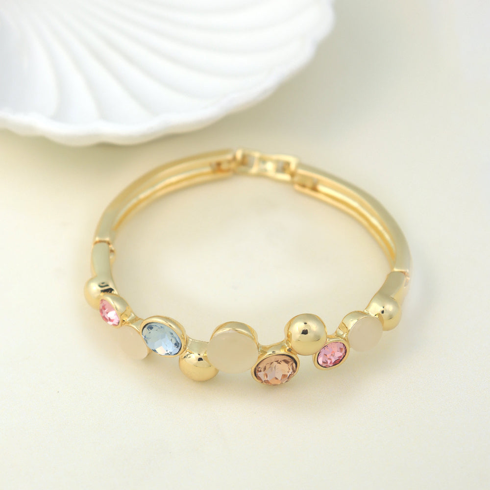 Elegant gold bracelet with colorful gemstones and mother-of-pearl accents, featuring a chic bangle design. Perfect luxury jewelry for fashion and gift ideas. (Unique keywords: gemstone bangle, mother-of-pearl jewelry