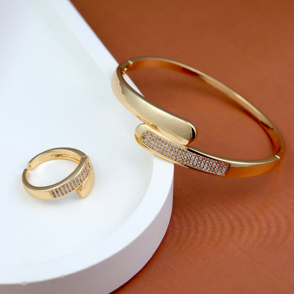 Luxury gold-plated bracelet and ring set with cubic zirconia accents, modern minimalist jewelry, perfect for special occasions, weddings, and daily wear. High-quality gold finish, tarnish-resistant, and lightweight for comfortable wear. Ideal fashion accessory for gifting and styling.