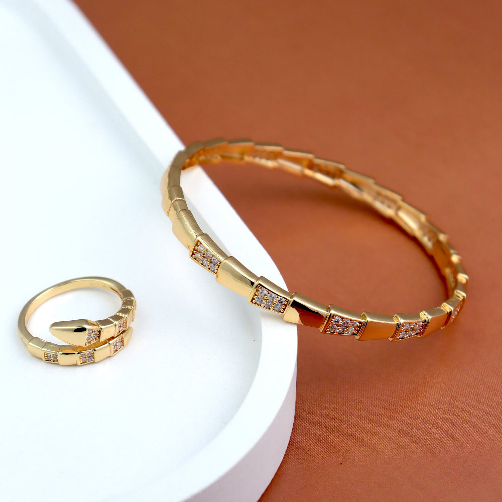 Elegant gold-plated jewelry set featuring a stylish bracelet and matching ring with cubic zirconia accents. Perfect for wedding accessories, party wear, and luxury gift ideas. (Unique keywords: cubic zirconia bracelet, designer ring set, fashion jewelry gift