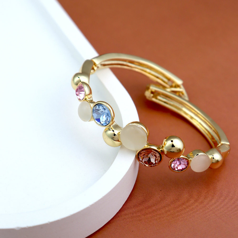 Elegant gold bracelet with colorful gemstones and mother-of-pearl accents, featuring a chic bangle design. Perfect luxury jewelry for fashion and gift ideas. (Unique keywords: gemstone bangle, mother-of-pearl jewelry
