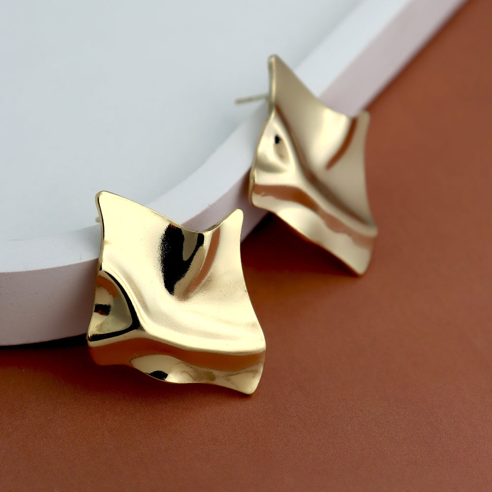 Trendy abstract gold-plated stud earrings with a unique wavy design, perfect for a bold and modern statement look. Lightweight, anti-tarnish, and crafted from high-quality brass for durability. Ideal for parties, formal events, and everyday elegance. Unique Keywords: Sculptural Earrings, Avant-Garde Jewelry.