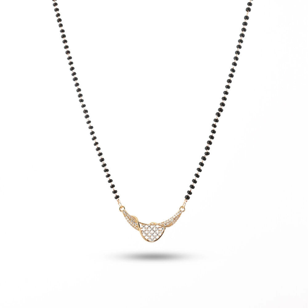 Necklace with black beads and a gold pendant on a white background