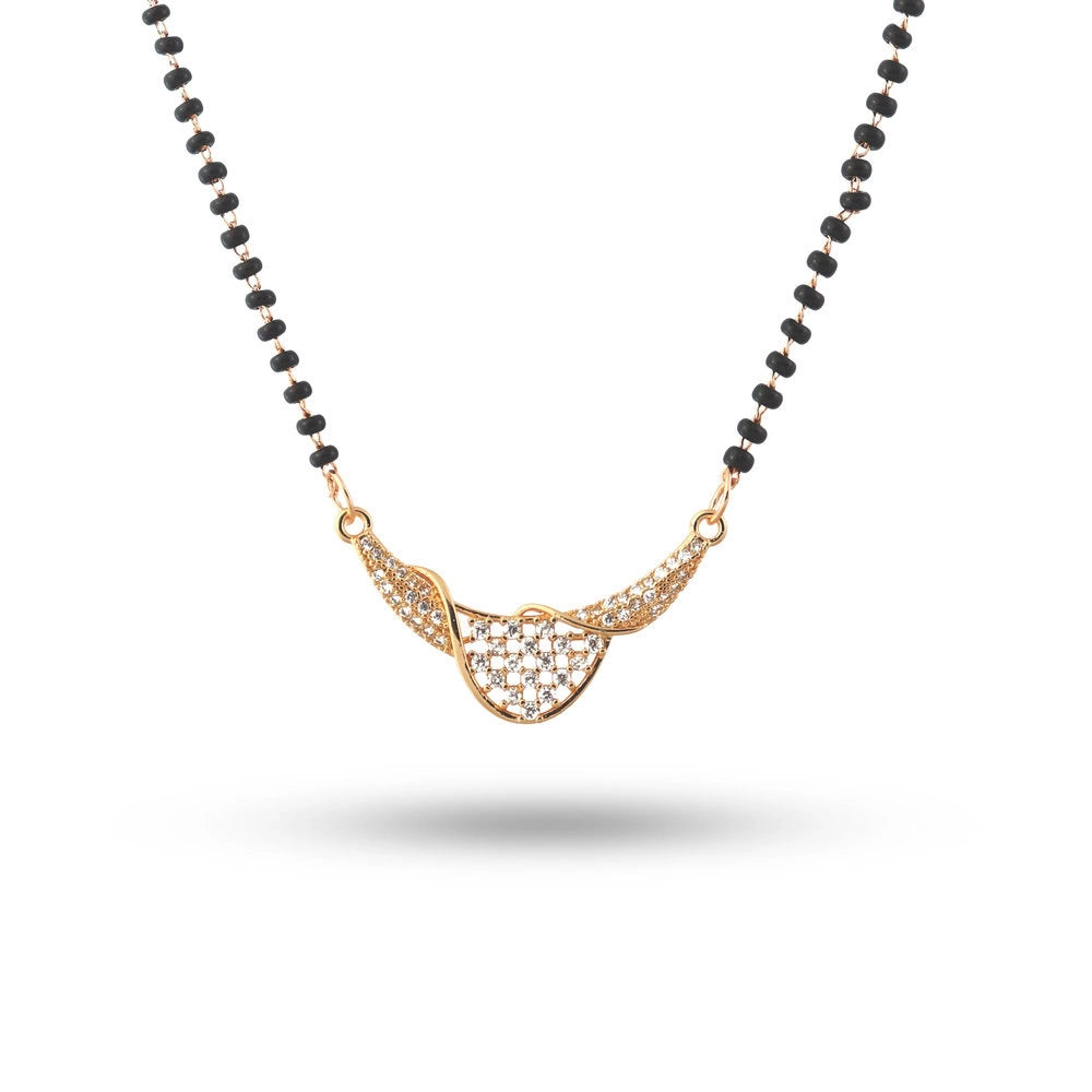 Necklace with black beads and gold heart-shaped pendant on a white background