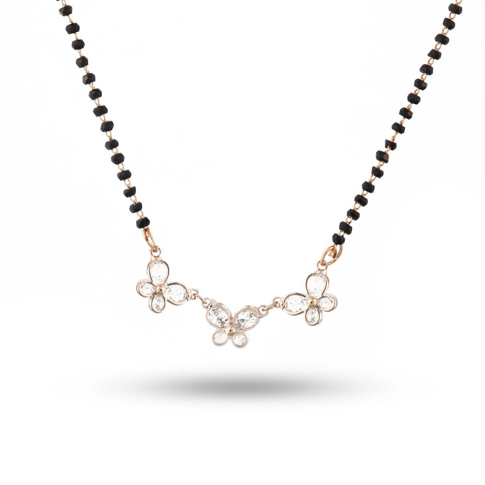 Necklace with black beads and butterfly-shaped pendants on a white background