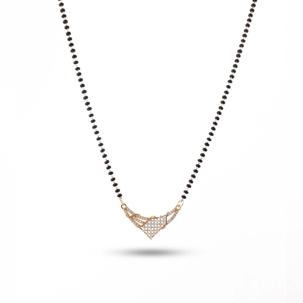 Necklace with black beaded chain and rose gold pendant on a white background