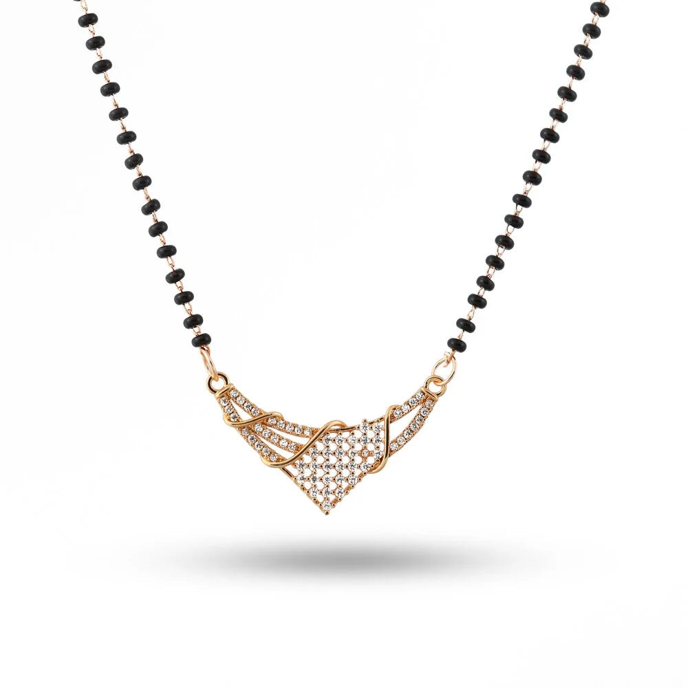 Necklace with black beads and a gold pendant on a white background