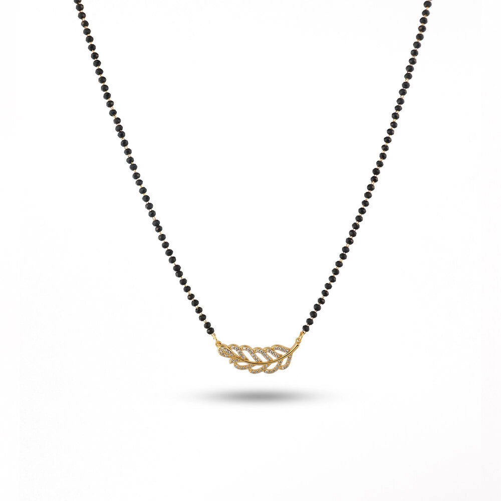 Necklace with gold leaf pendant on a white background