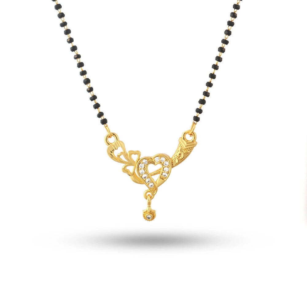 Gold necklace with black beads on a white background