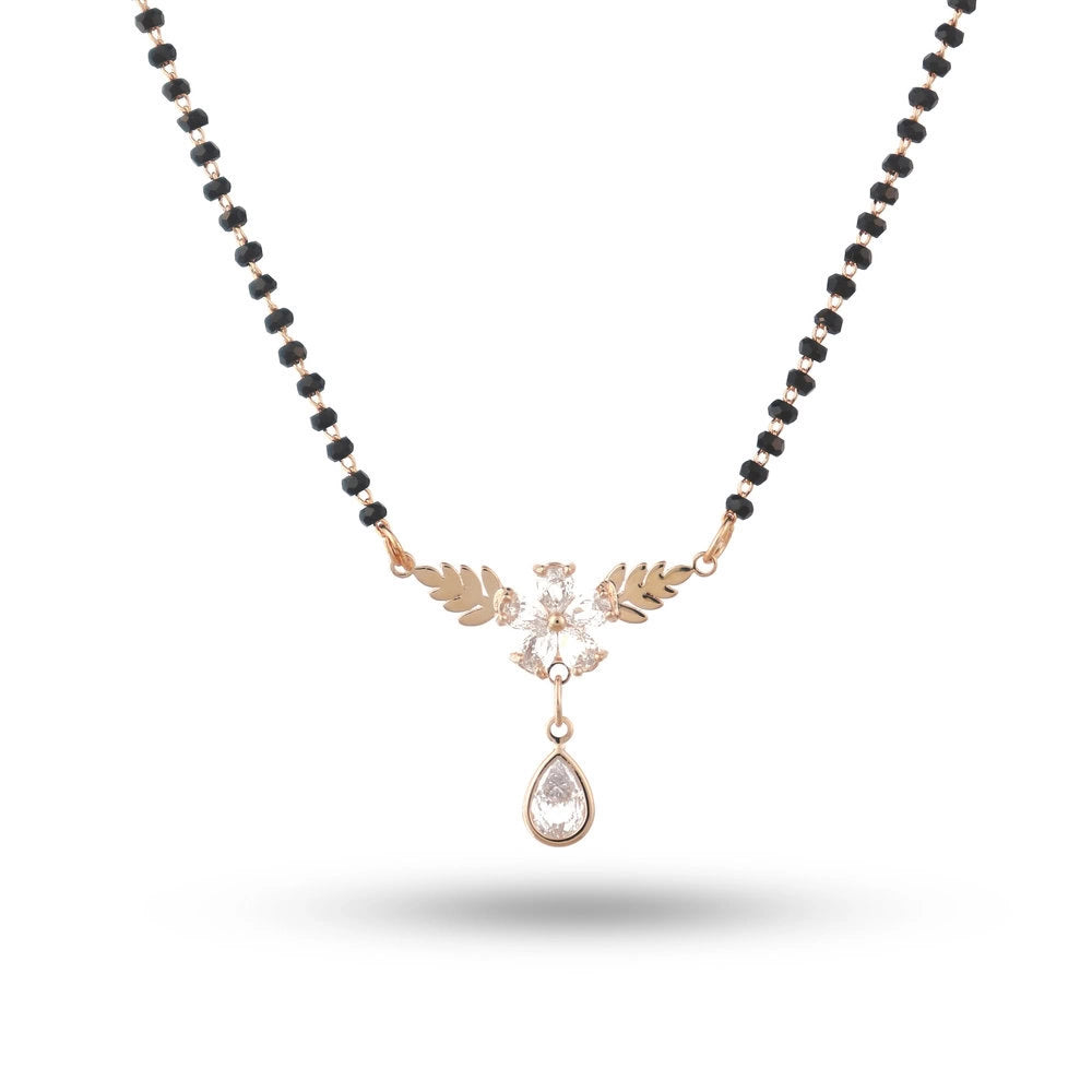 Necklace with black beads and a teardrop pendant on a white background