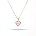 Rose gold heart-shaped necklace with diamonds on a white background