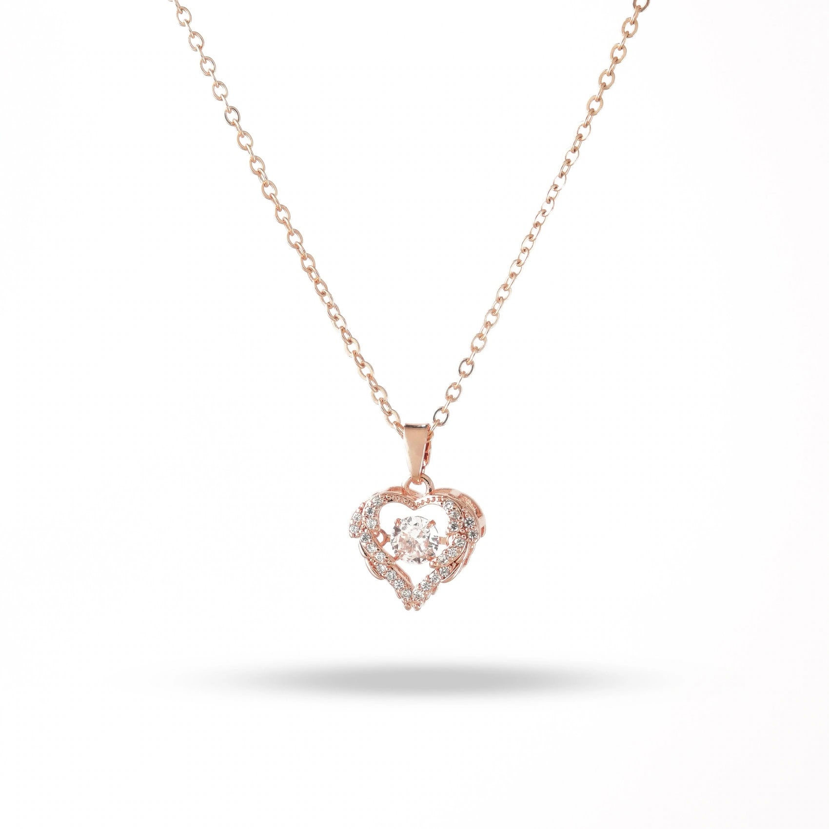 Rose gold heart-shaped necklace with diamonds on a white background