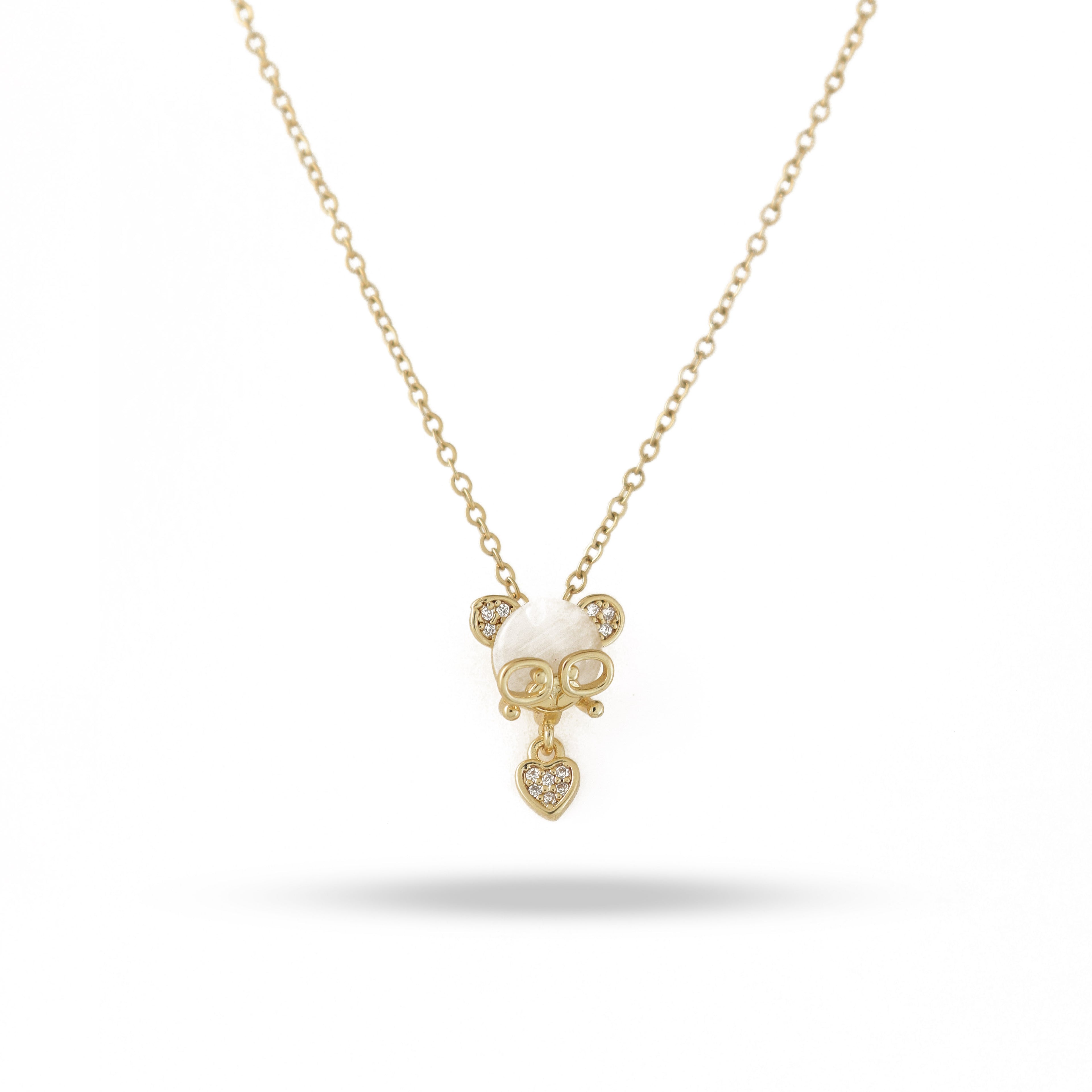 Gold necklace with a cat-shaped pendant on a white background