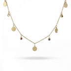 Gold necklace with round pendants on a white background