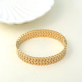Trendy gold-plated designer bracelet for women – premium fashion jewellery with intricate link pattern, perfect for wedding, festive looks, or daily wear styling by Own It Pure.