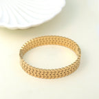 Trendy gold-plated designer bracelet for women – premium fashion jewellery with intricate link pattern, perfect for wedding, festive looks, or daily wear styling by Own It Pure.