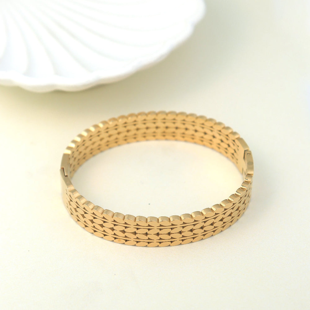 Trendy gold-plated designer bracelet for women – premium fashion jewellery with intricate link pattern, perfect for wedding, festive looks, or daily wear styling by Own It Pure.
