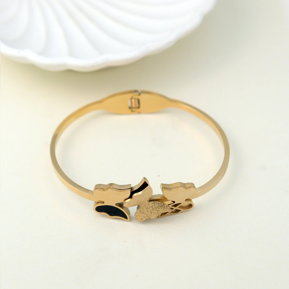 Elegant butterfly design gold-toned bracelet for women – stylish fashion jewellery with black enamel detail, perfect for partywear, festive outfits, and everyday glam by Own It Pure.