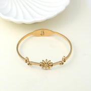 Trendy gold-plated floral bangle bracelet for women – lightweight designer fashion jewellery perfect for daily wear, casual outings, and festive occasions by Own It Pure.