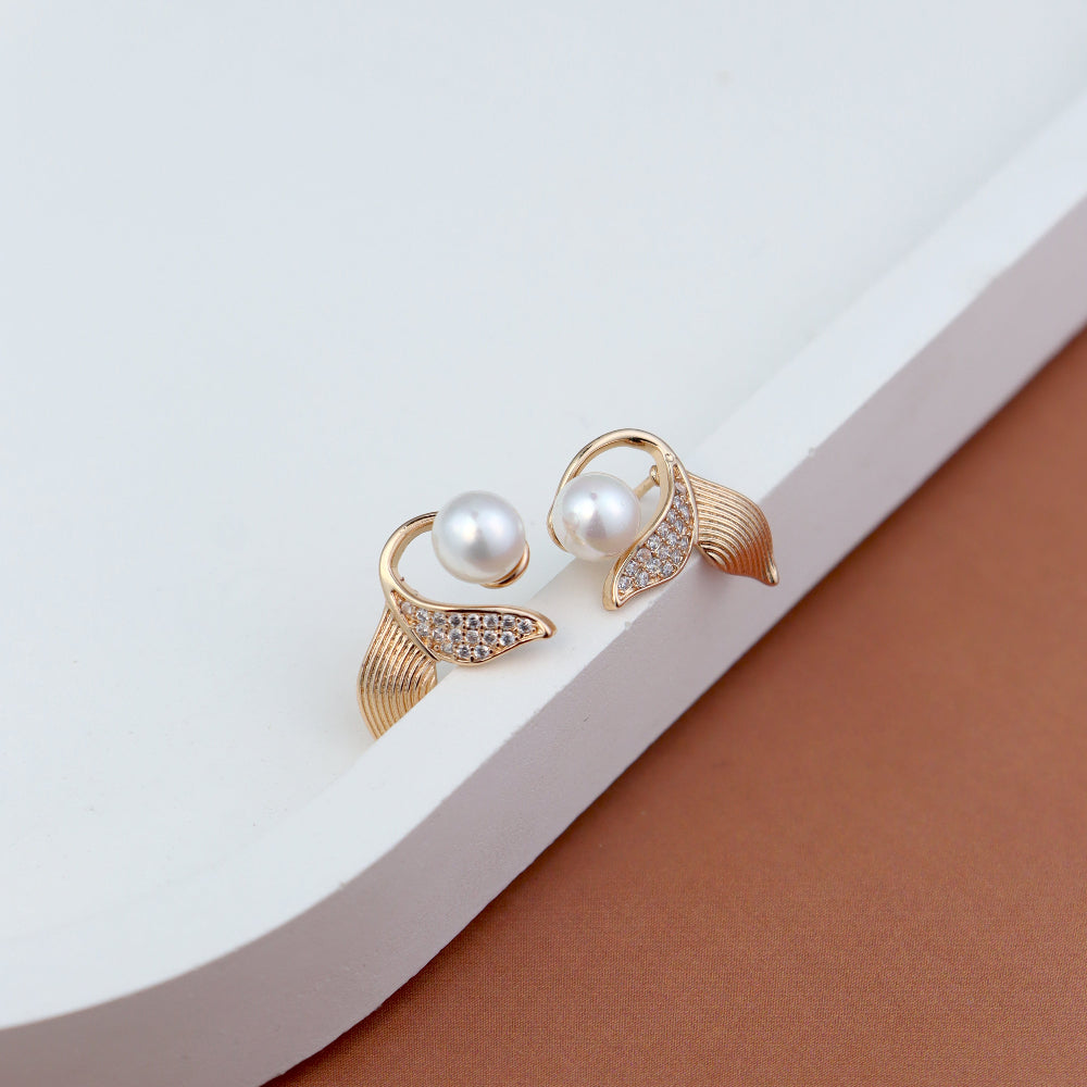 Elegant pearl stud earrings for women – gold-plated leaf design with sparkling CZ stones, premium imitation fashion jewellery ideal for party wear, bridal look, and gifting.